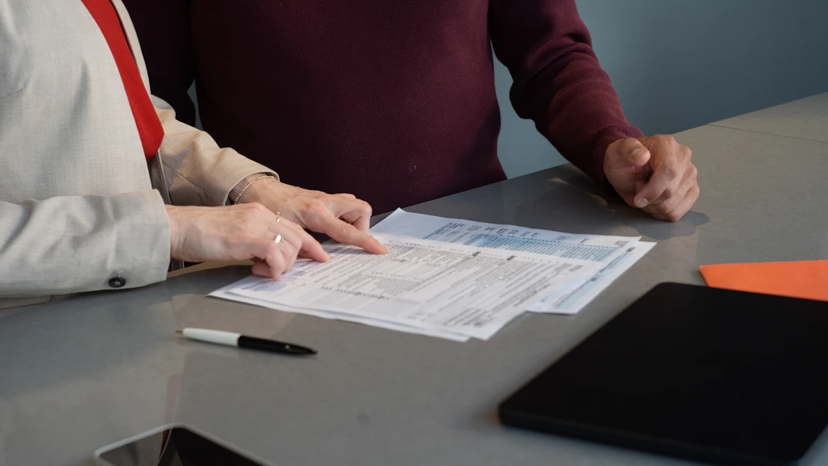 Two people reviewing printed forms at a desk with a pen and phone, representing an owner checking loan and contract paperwork before canceling a timeshare