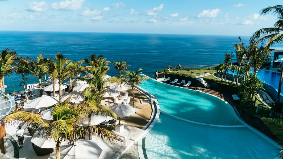 A cliffside resort pool overlooking the ocean, representing the kind of U.S. vacation property sold under a timeshare contract