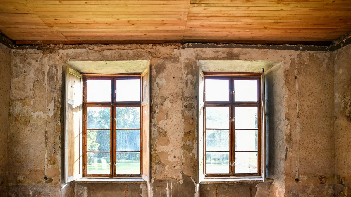 A resort room stripped back to bare walls during refurbishment, representing the discretionary renovation work that U.S. timeshare owners are billed for through special assessments